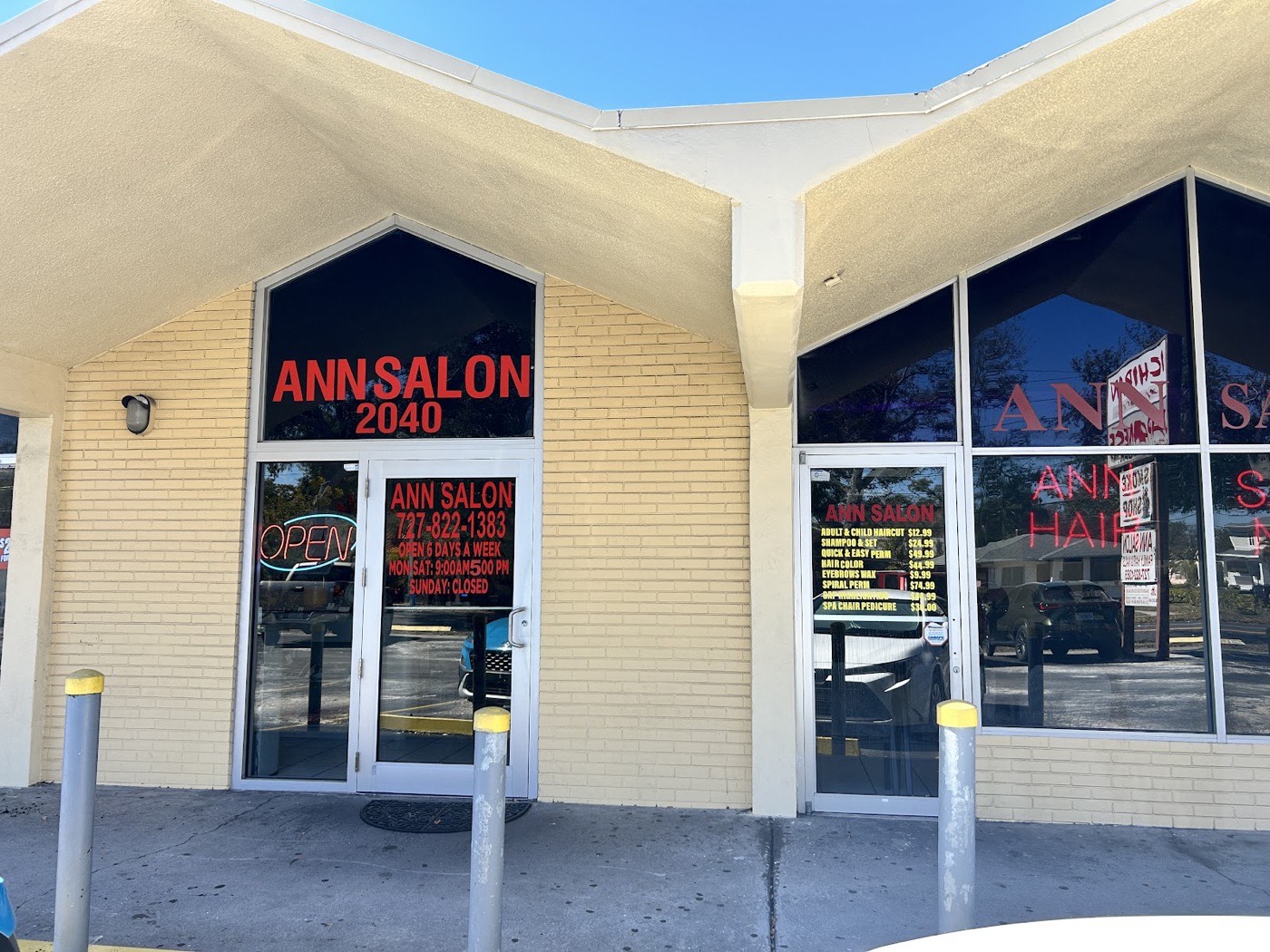 Ann’s Salon storefront, with its yellow brick front and red window lettering